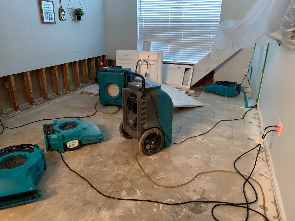 Dehumidifier in flood-cut room for Water Damage Restoration in Woodbury